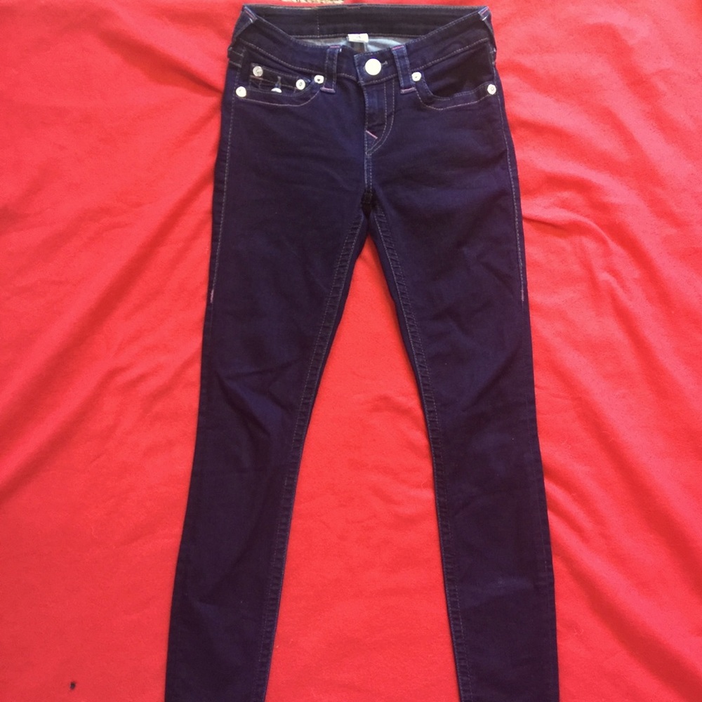 Dark skinny jeans. Pink details. Silver hardware.